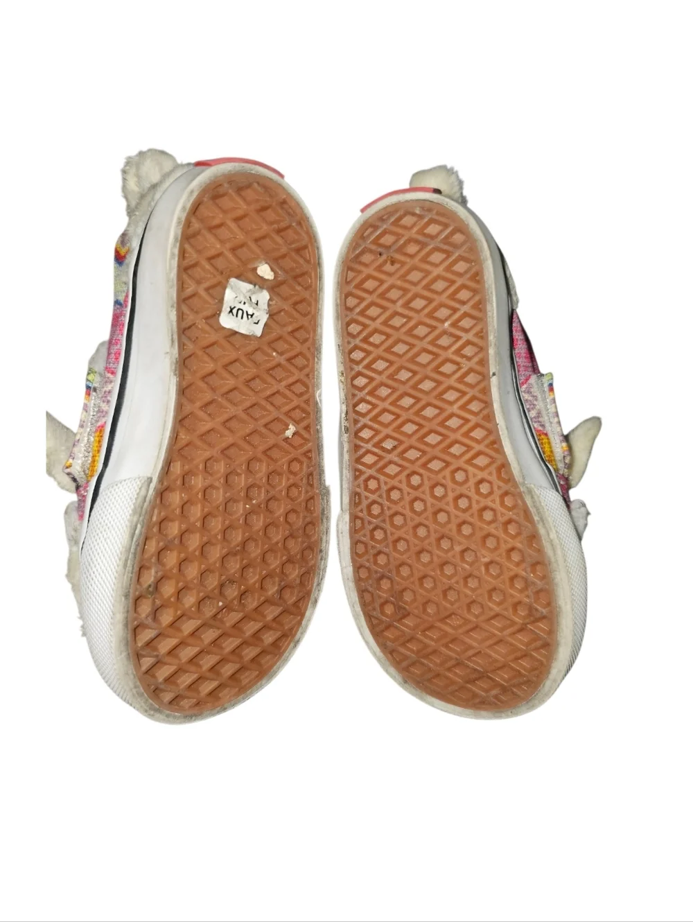 Vans Slip-On V Alpaca sneakers featuring a faux fur llama design.